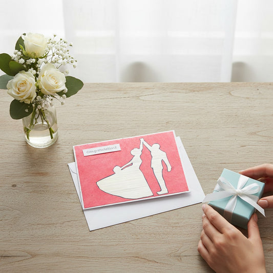 Lokta Cards hand-carved greeting card featuring a couple dancing silhouette on a pink textured background with a 'Congratulations' label.